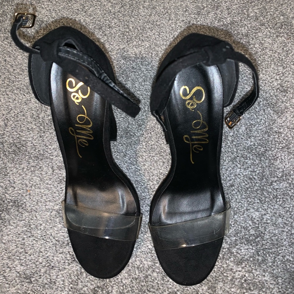 Chunky black heels with a clear strap